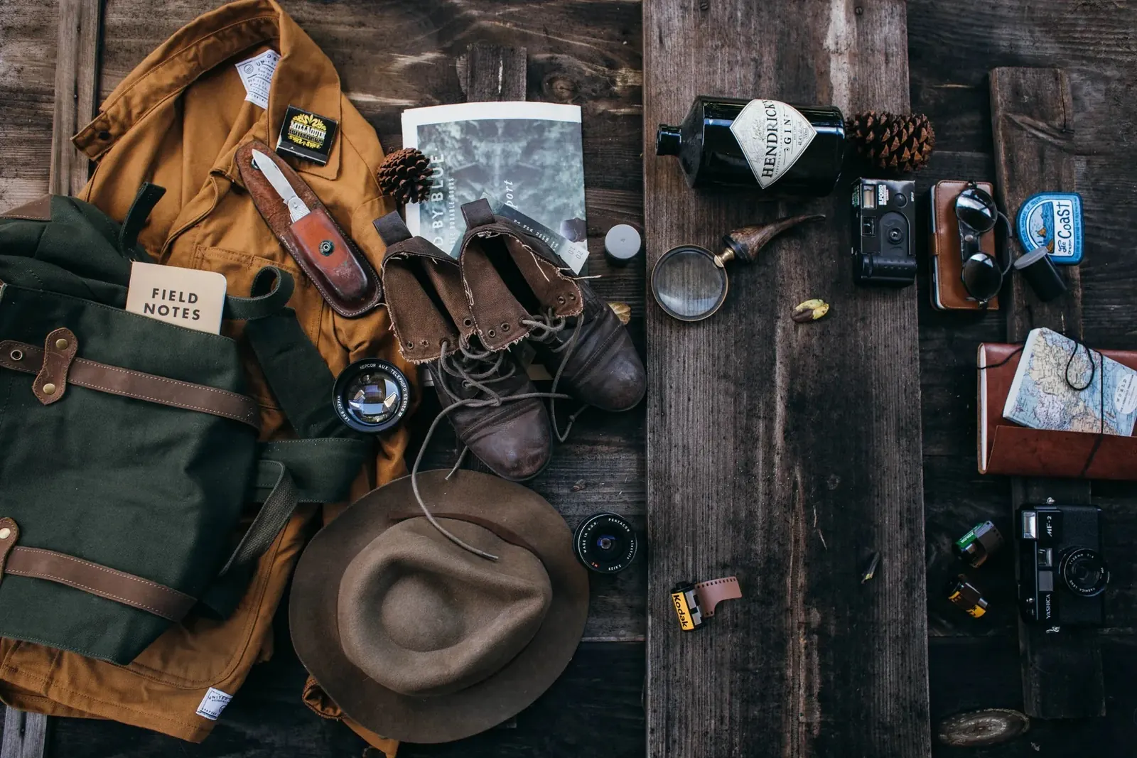 Travel gear and practical essentials laid out for a road trip